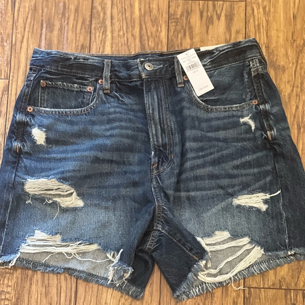 Women’s Brand New American Eagle mid length blue denim shorts.